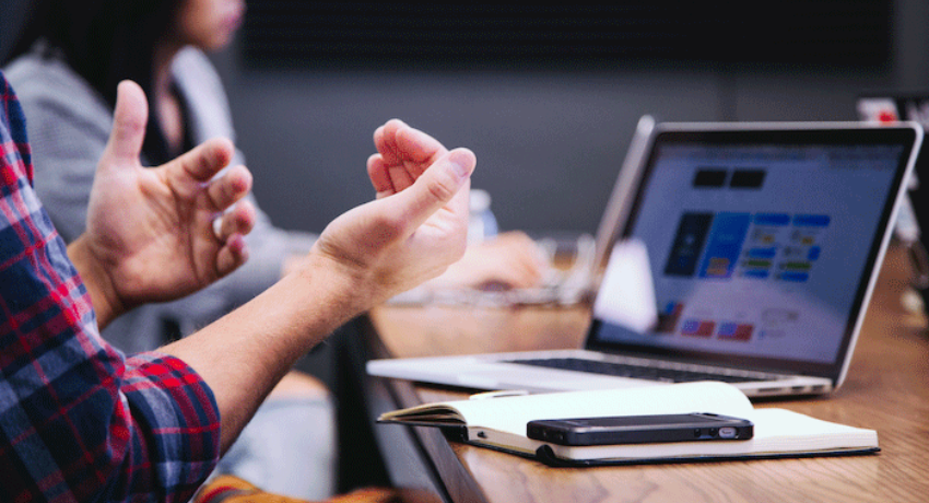 Your Guide To Learning Platforms - person talking in front of a laptop on a table