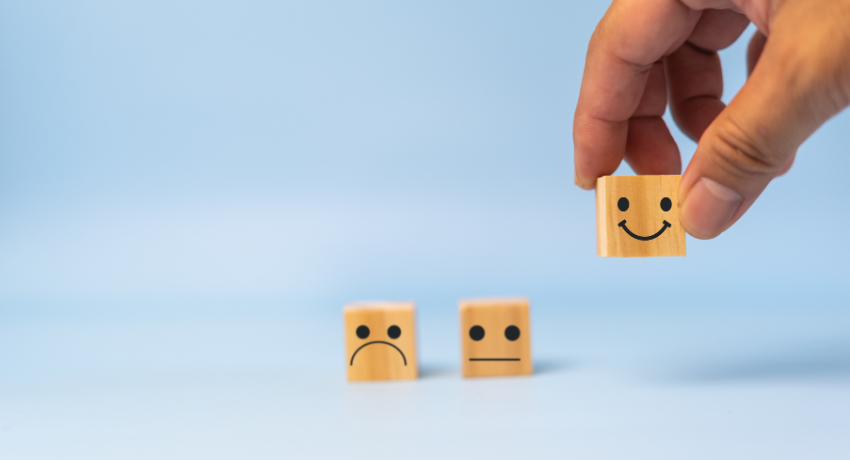 The Power of Effective Feedback - blocks with smiley, sad, and neutral faces on